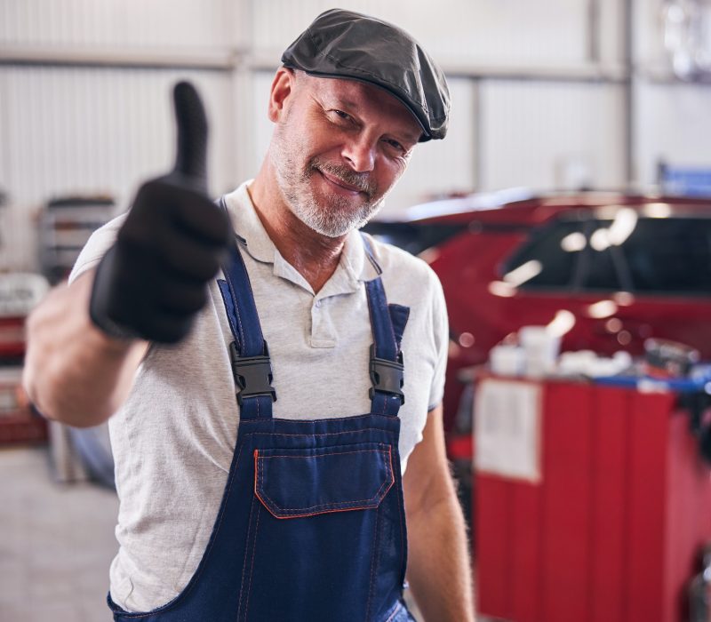 handsome-mechanic-giving-thumbs-up-and-smiling.jpg